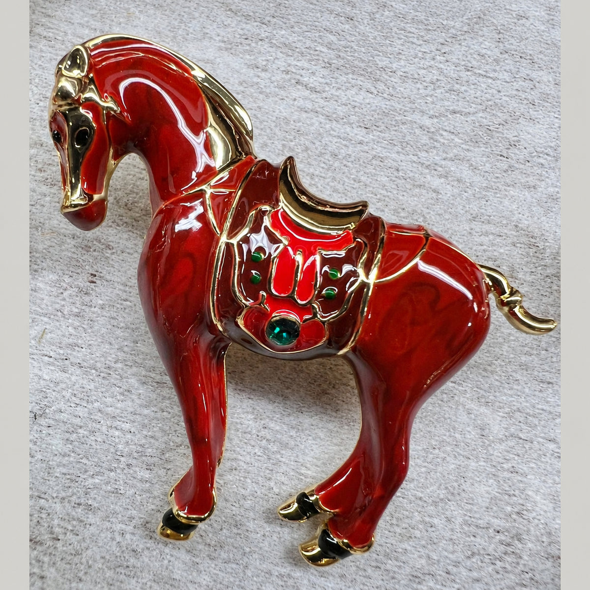 Red horse brooch with decorative saddle detailing