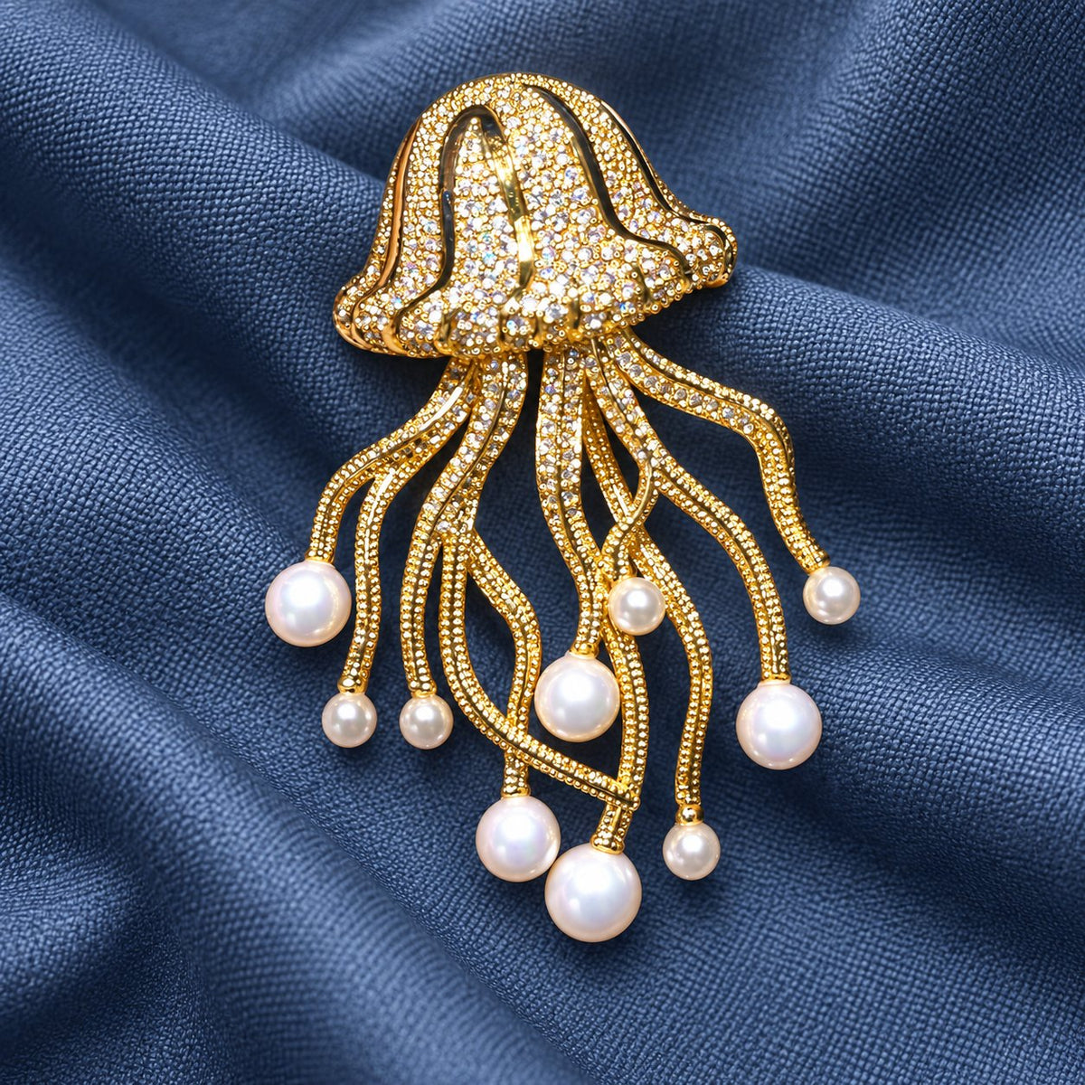 Gold-tone jellyfish brooch with white shell pearl drops