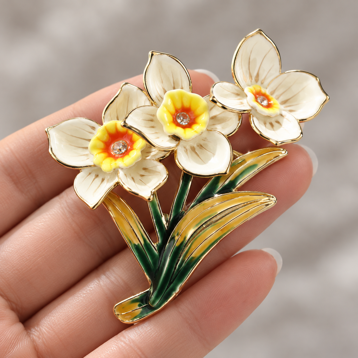 Vintage Daffodil brooch held in a hand