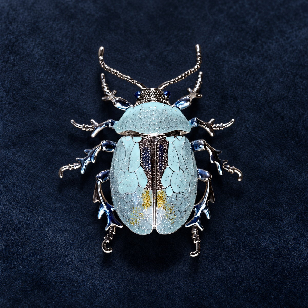 Blue enamel beetle brooch, front view