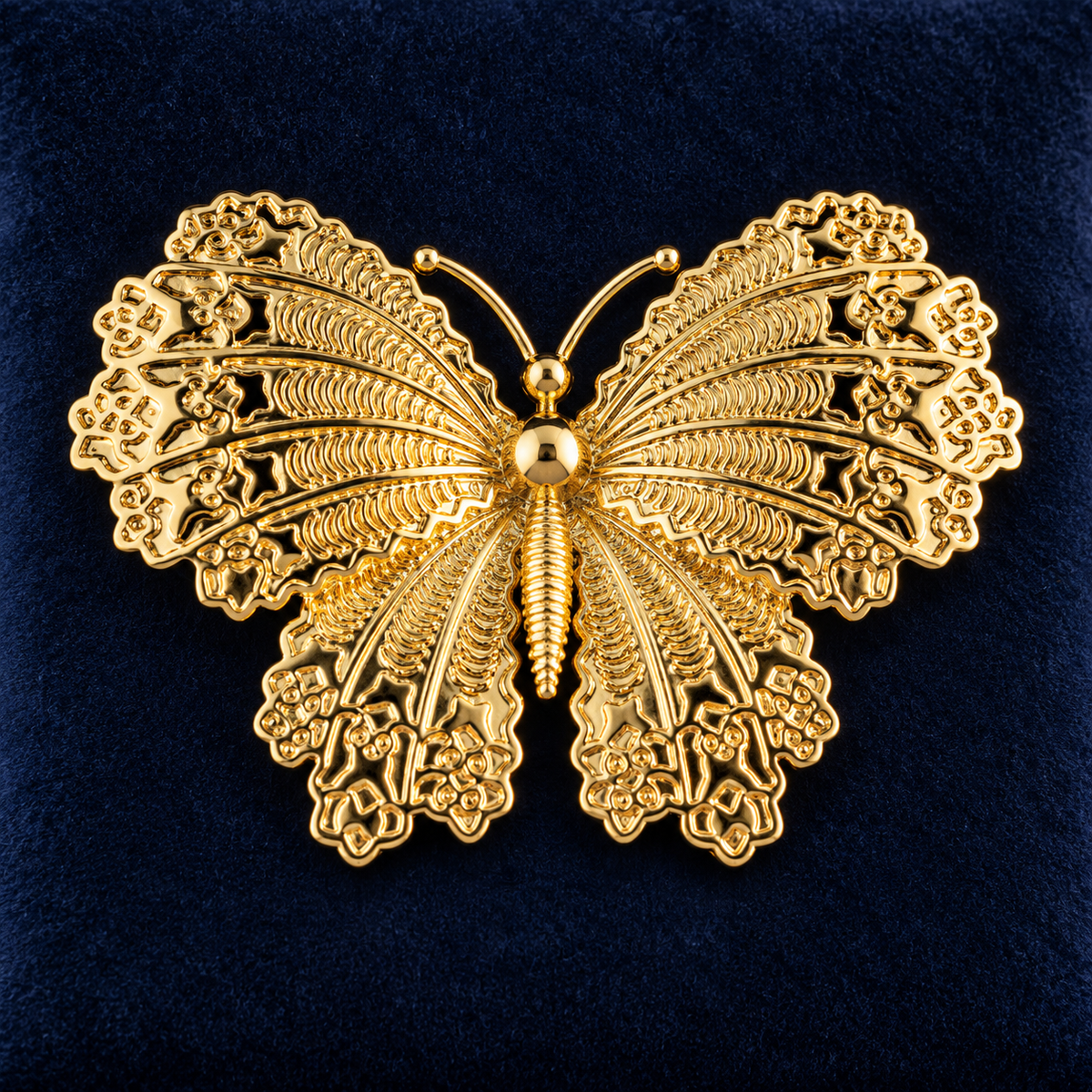 Gold Tone butterfly brooch with intricate wing details