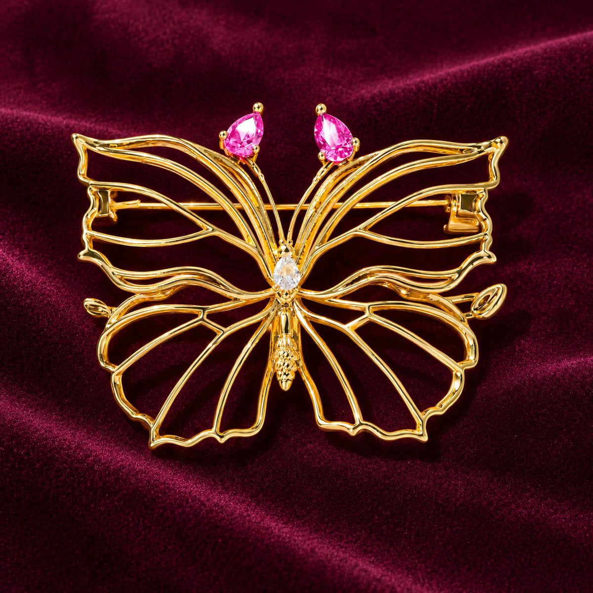 Rose Pink openwork butterfly brooch, front view with gold-tone frame and pink accents
