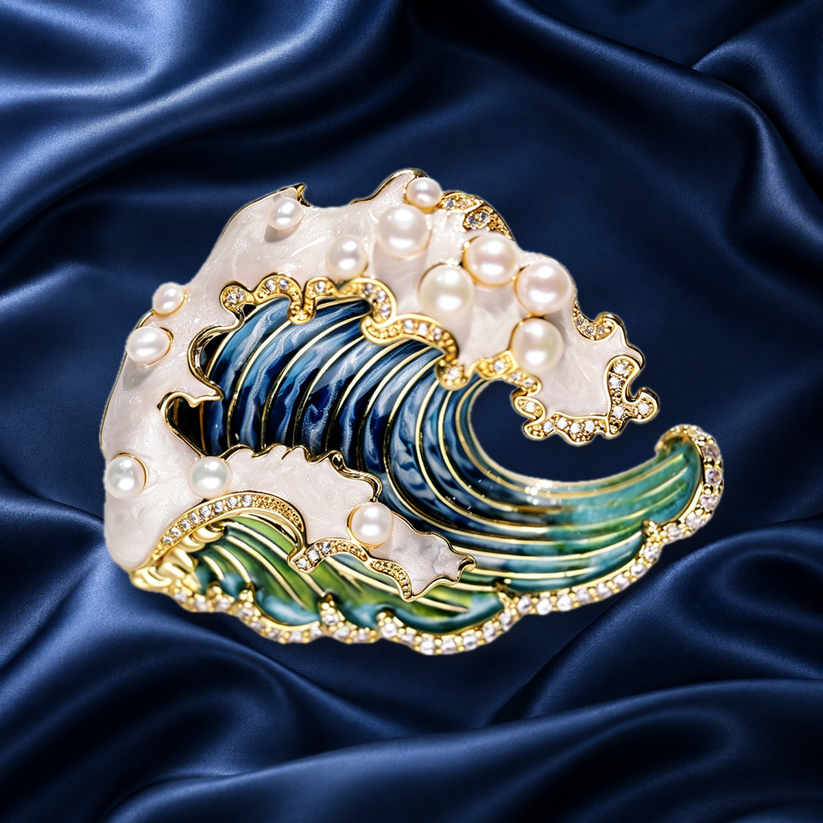 Blue enamel wave brooch with pearls and gold-tone border on navy satin