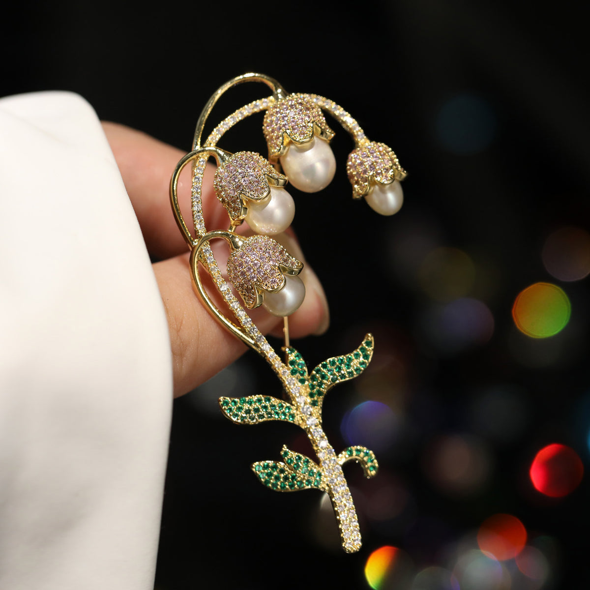 Lily of the valley brooch with gold-tone freshwater pearl drops, handheld view