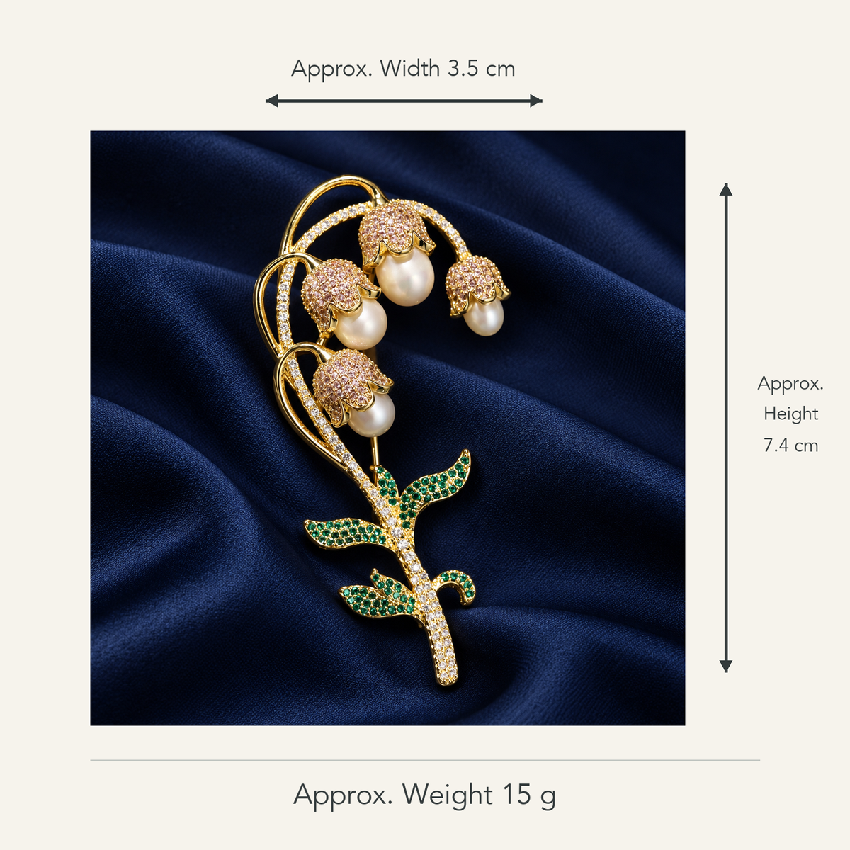 Lily of the valley brooch with gold-tone freshwater pearl drops, approximately 3.5 cm wide by 7.4 cm high, 15 g