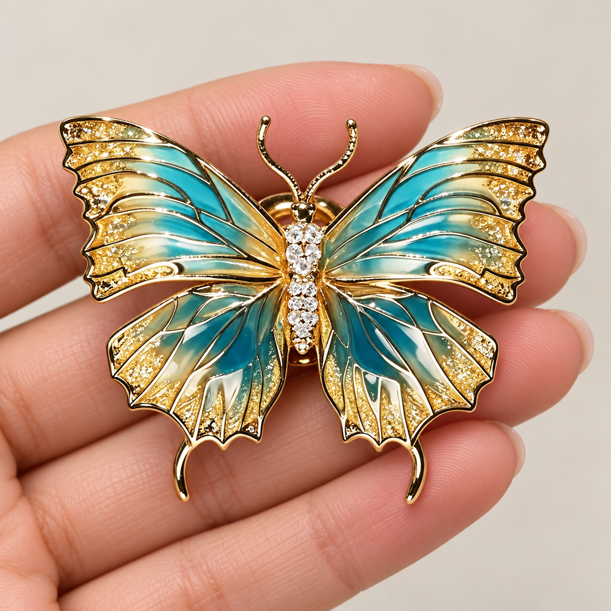 Iridescent Blue Butterfly brooch held in a hand