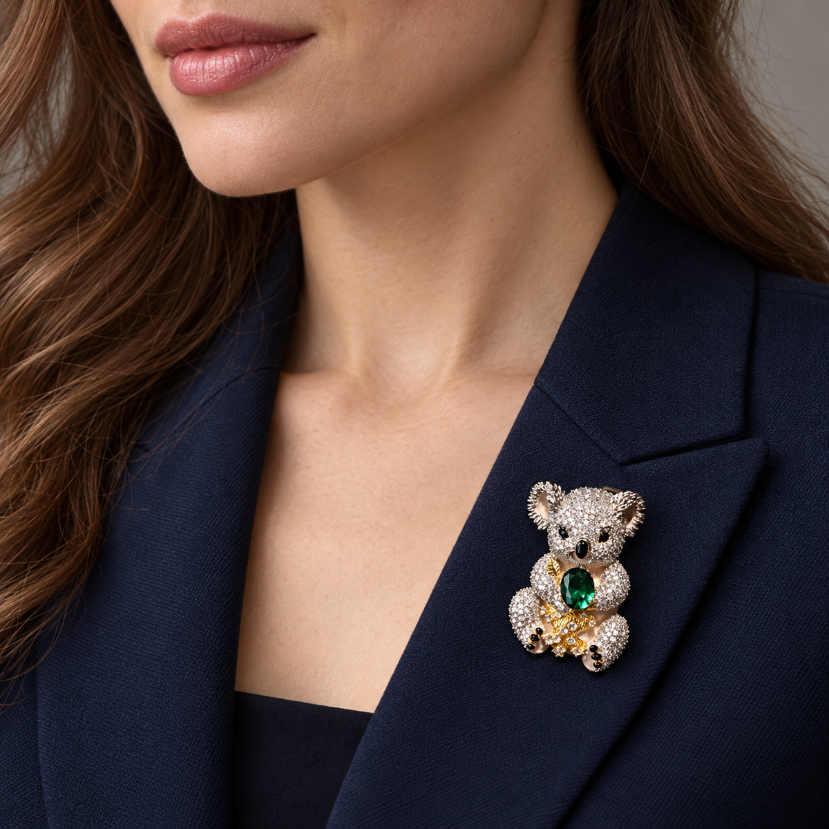 Emerald Green Koala brooch worn on a jacket lapel