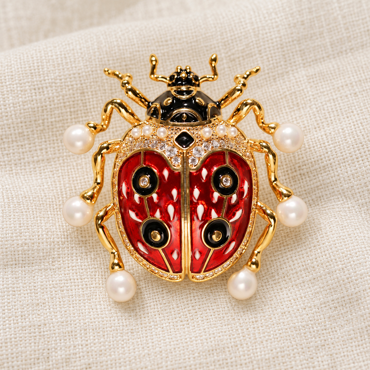 Shell Pearl Gold ladybug brooch in a tabletop setting