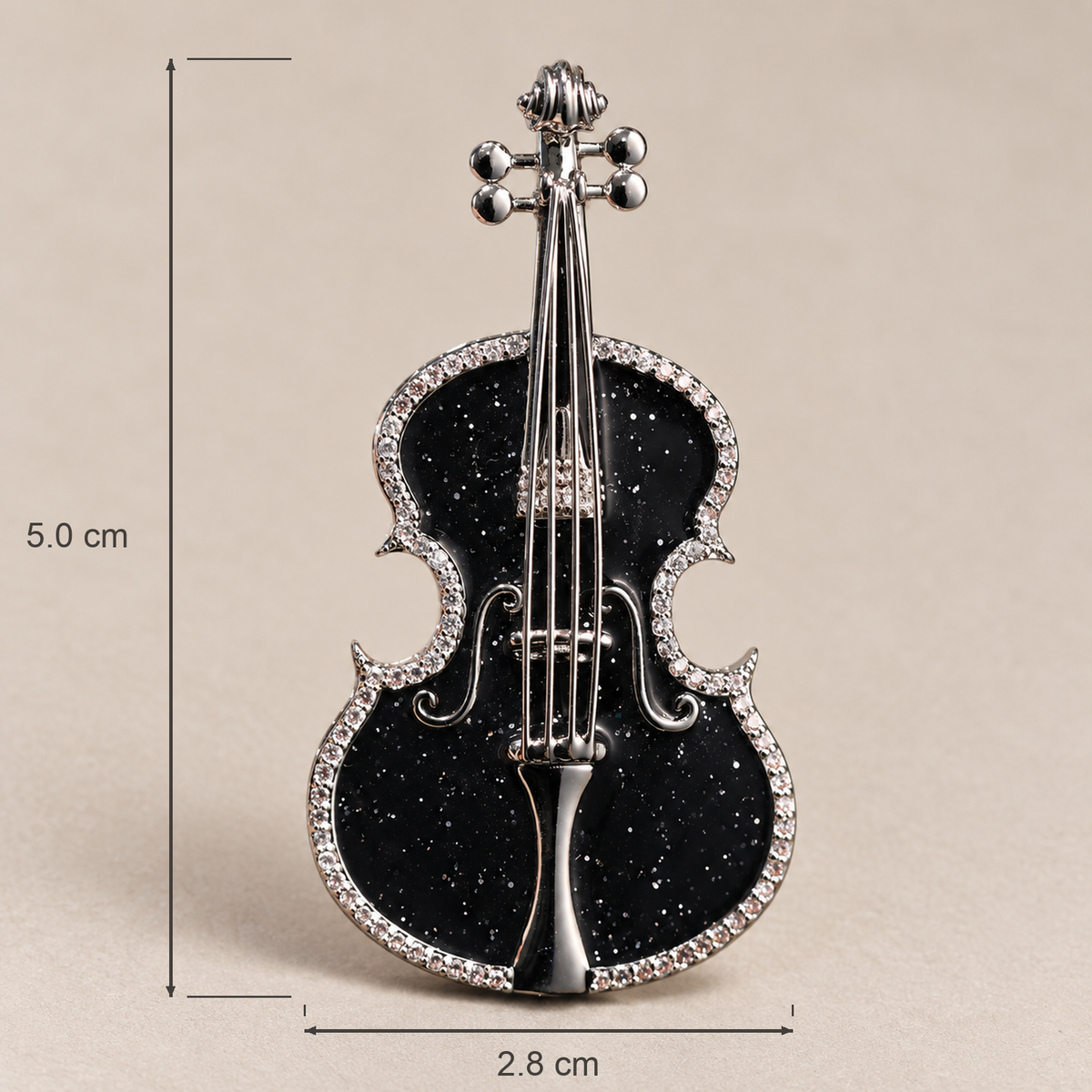 Black violin brooch measuring approximately 2.8 cm wide and 5.0 cm high