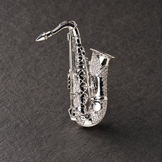 Silver tone saxophone brooch, full front view