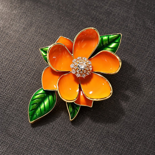 Gold tone orange blossom enamel brooch, front view