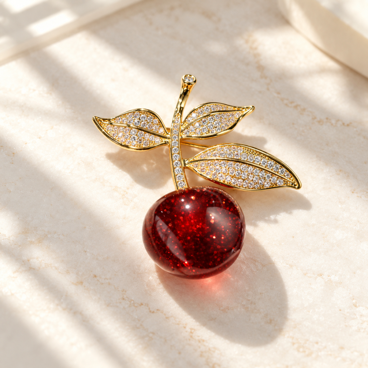 Vintage Cherry brooch in a tabletop setting