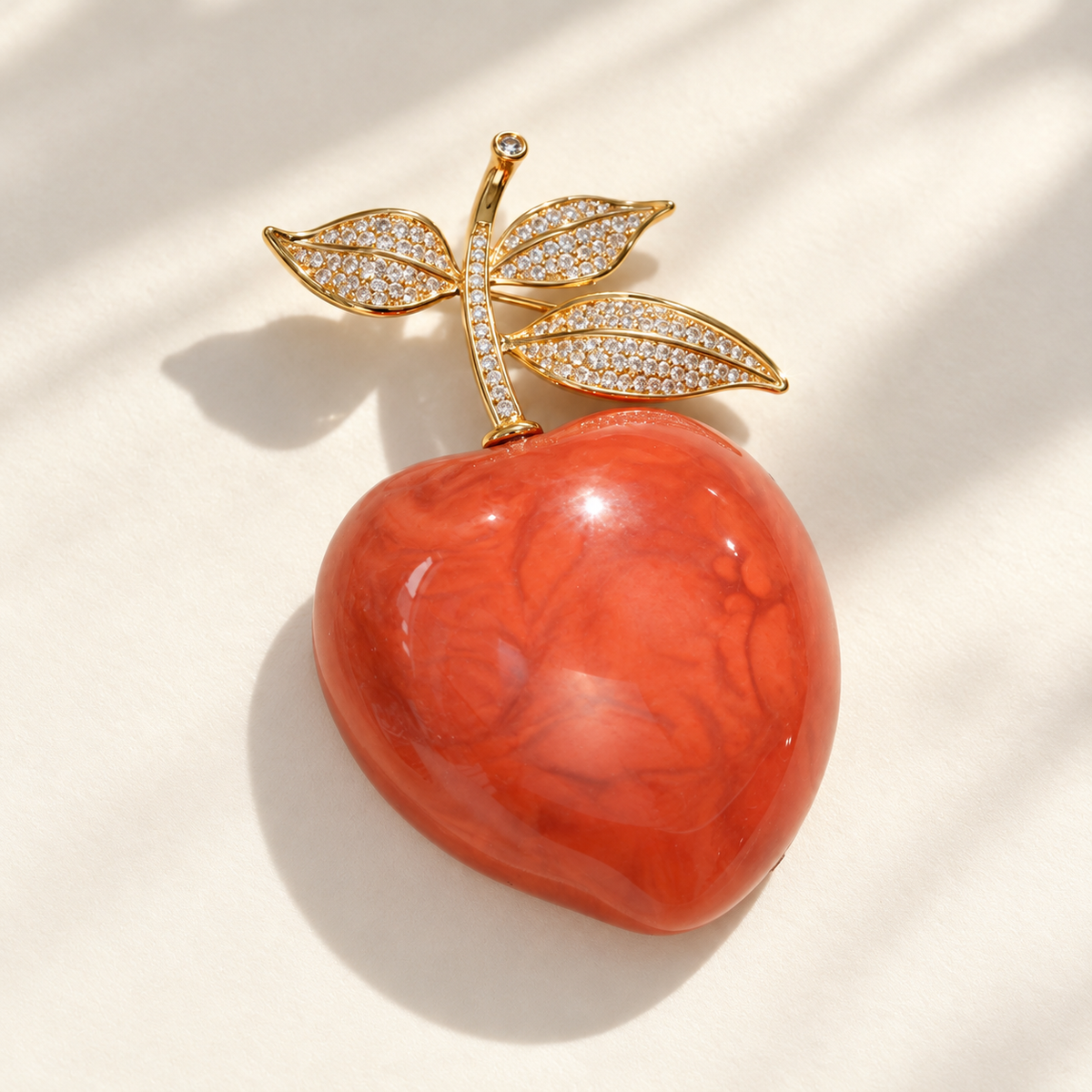 Vintage Peach brooch in a tabletop setting