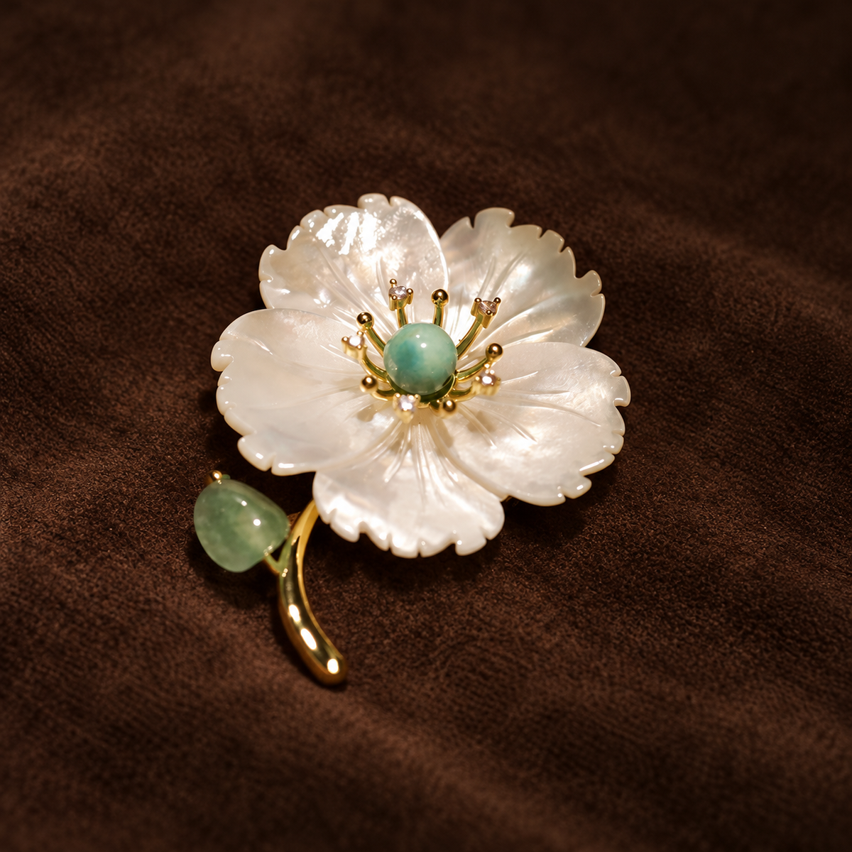 Green shell flower brooch with a curved stem