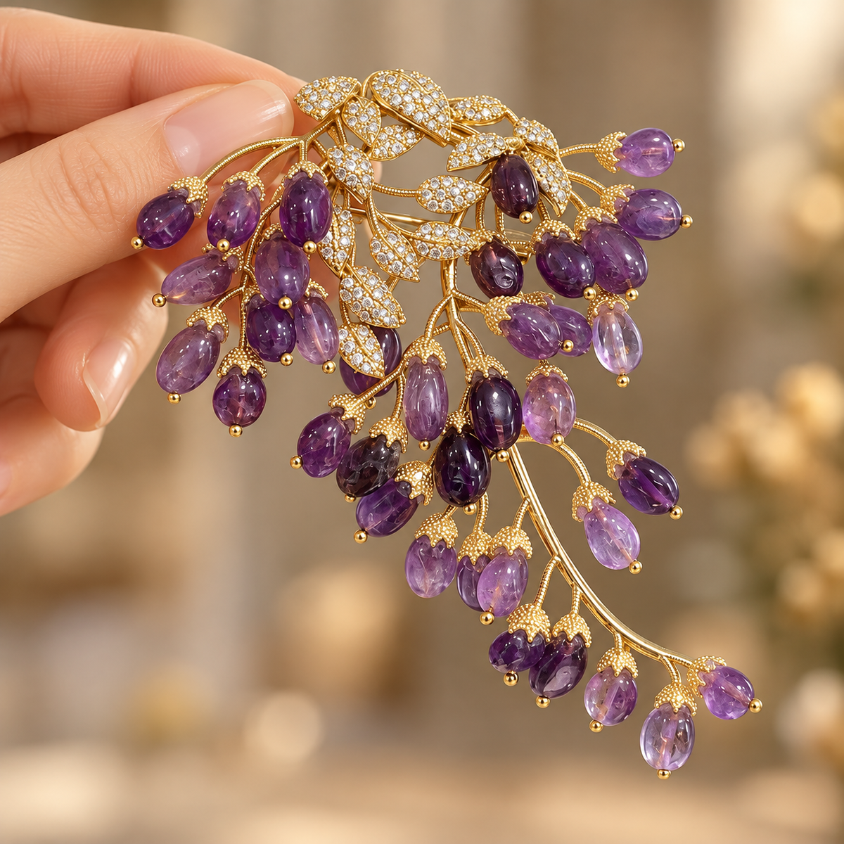 Natural Amethyst wisteria brooch, held in a hand