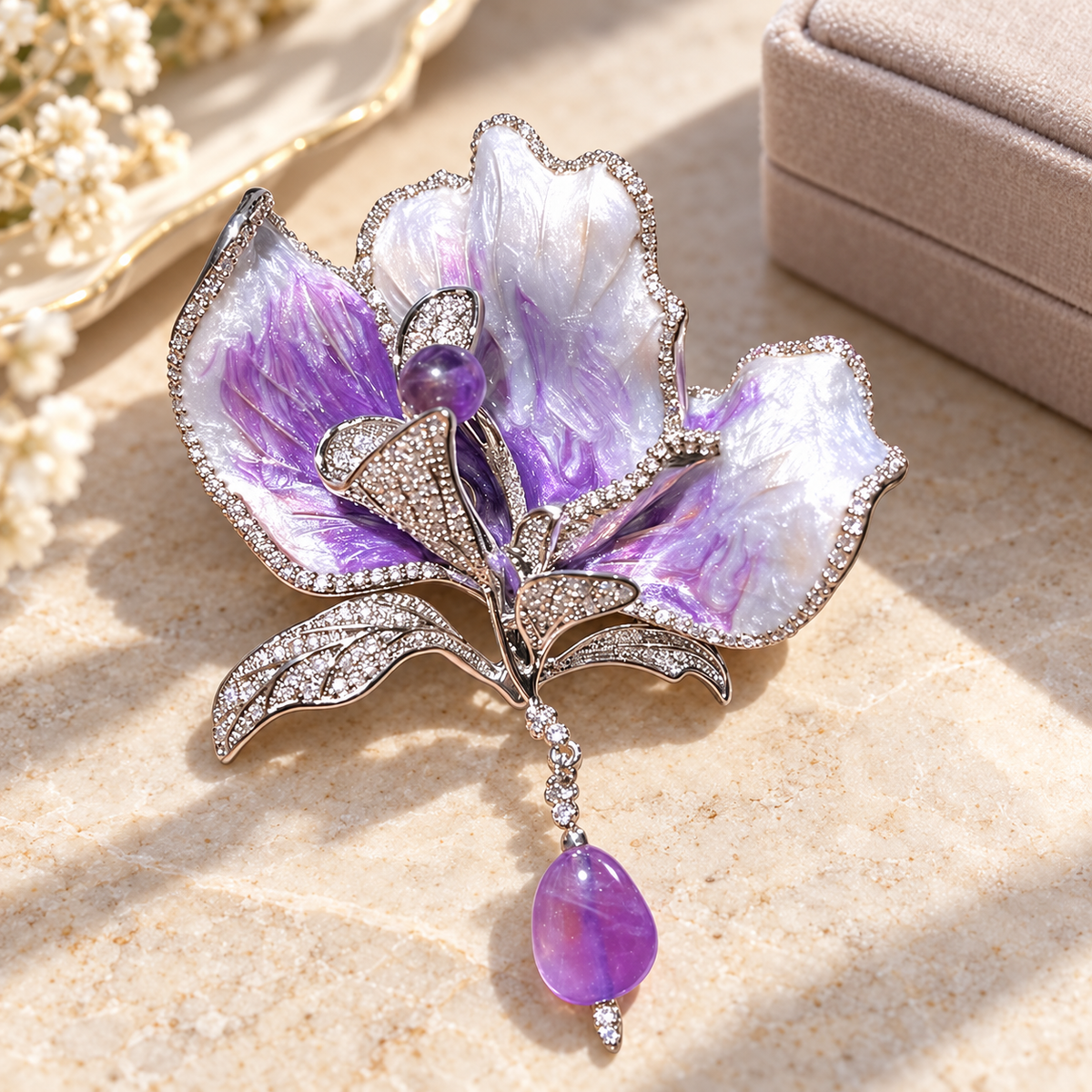 Purple with Purple Stone Drop canna flower brooch in a tabletop display