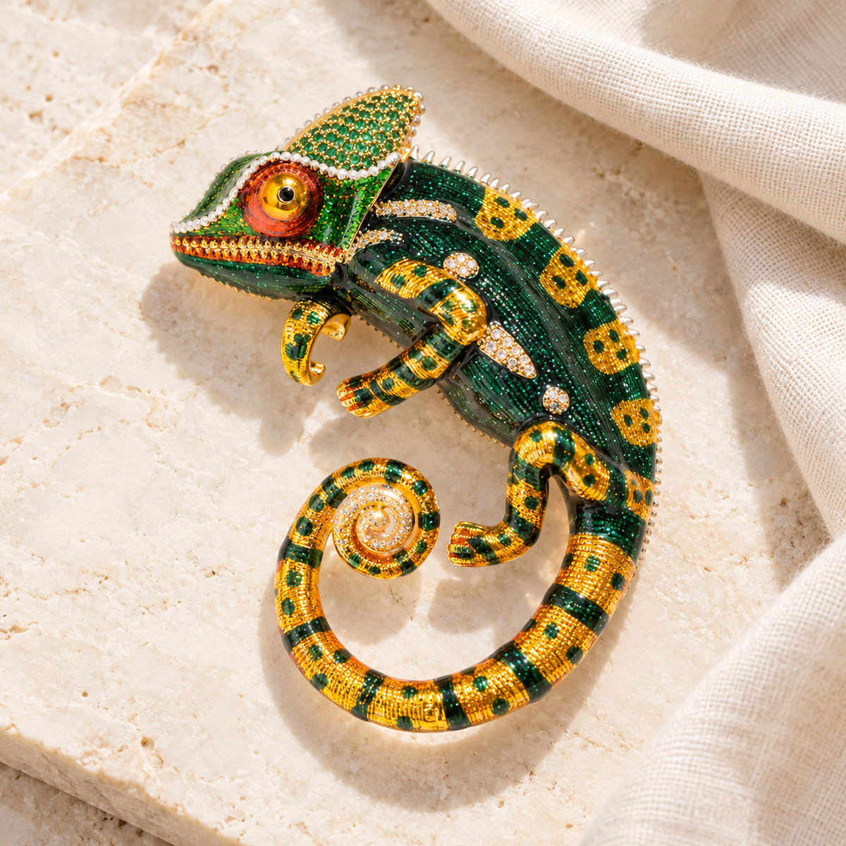 Green chameleon brooch in a styled tabletop display