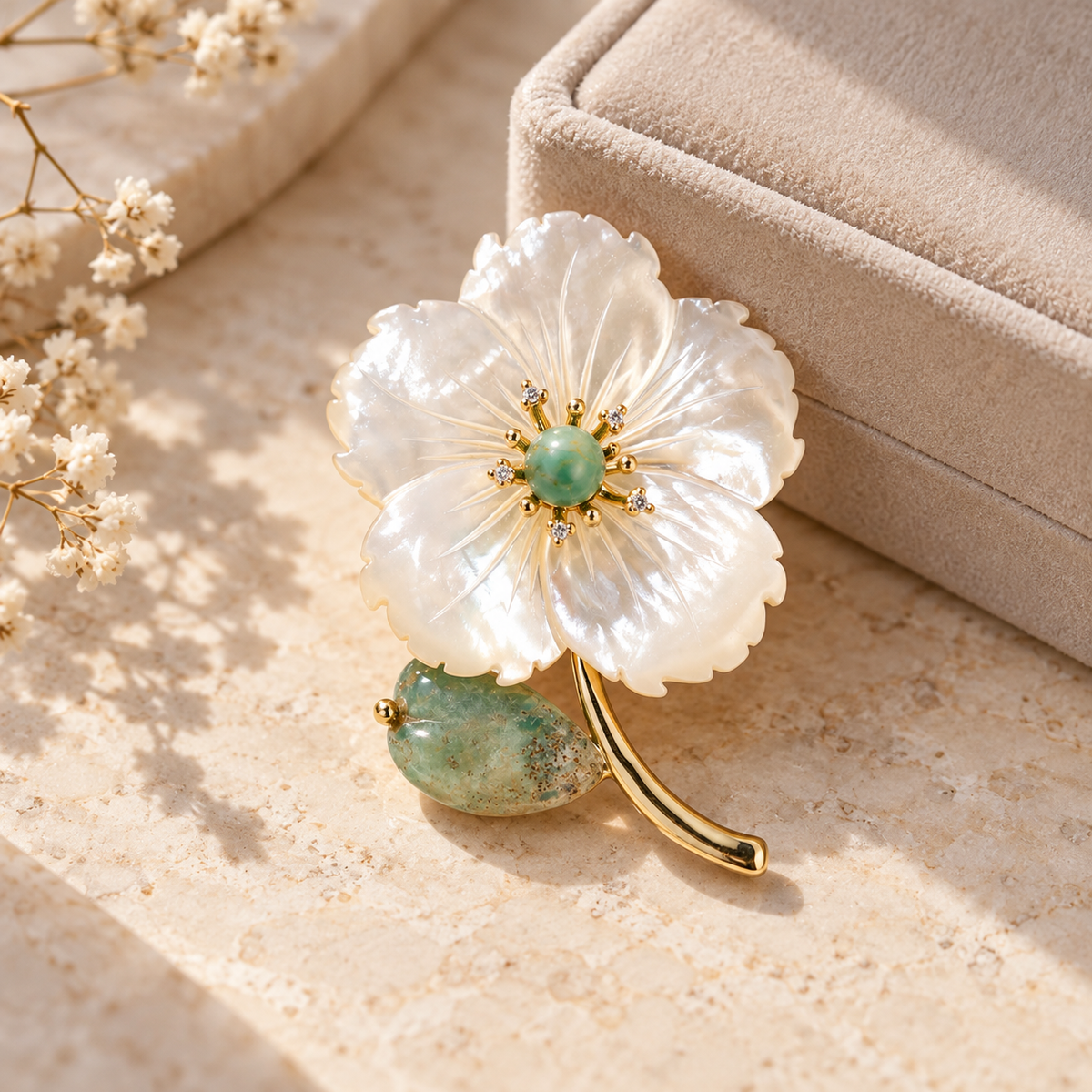 Green shell flower brooch in a tabletop display