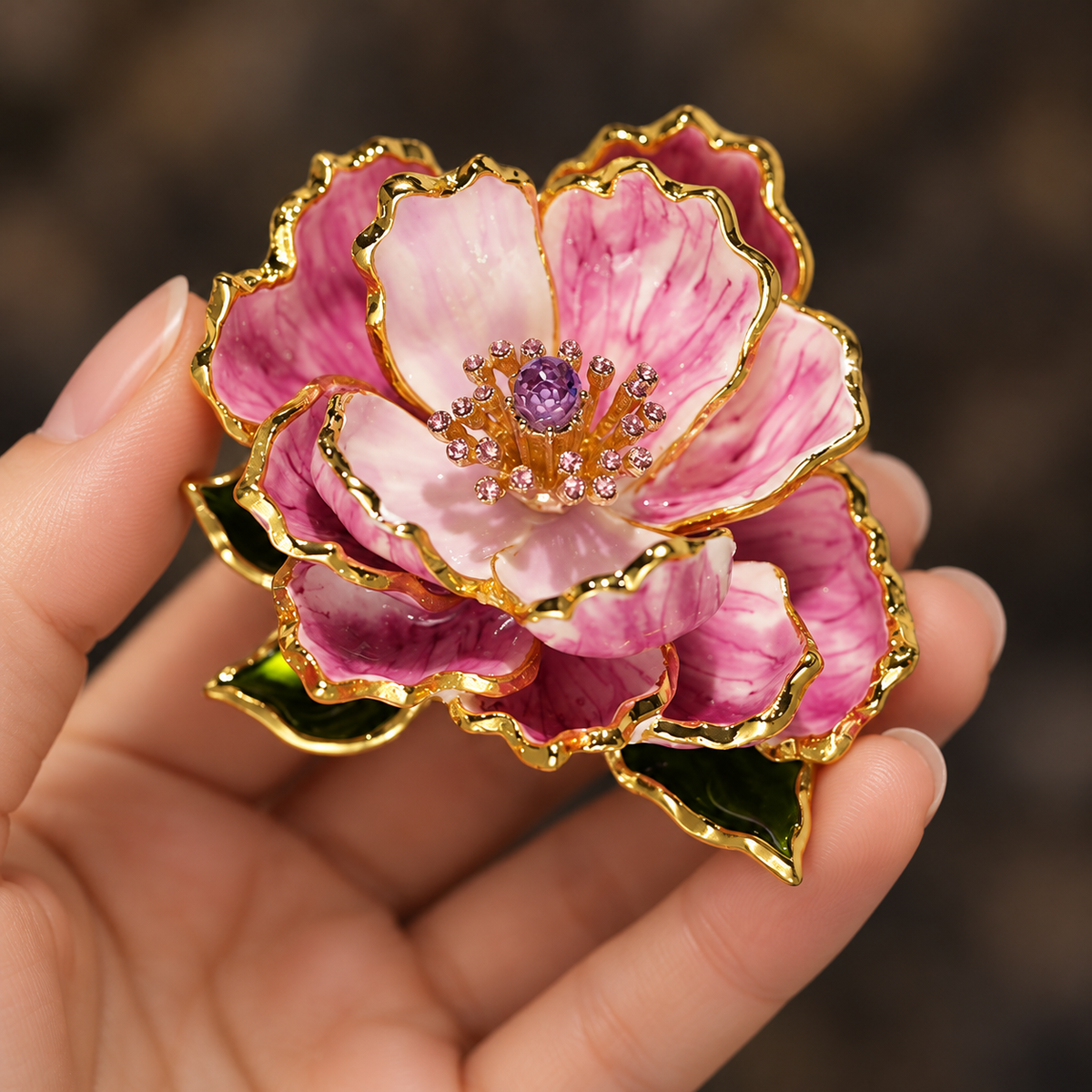 Purple peony brooch held in a hand