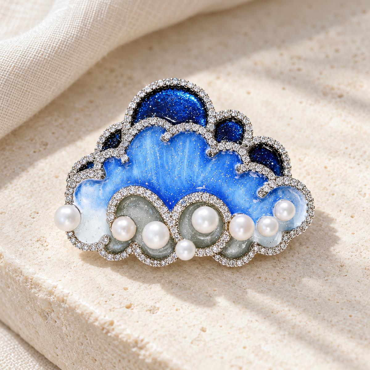 Blue cloud brooch in a styled tabletop display