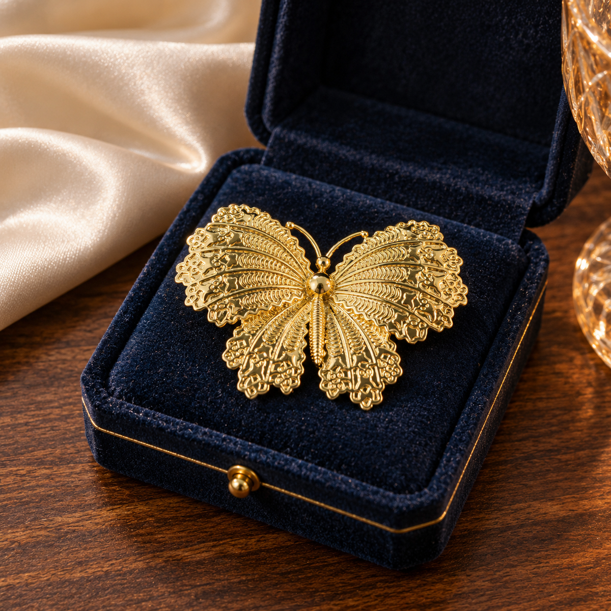 Gold tone butterfly brooch in a tabletop display