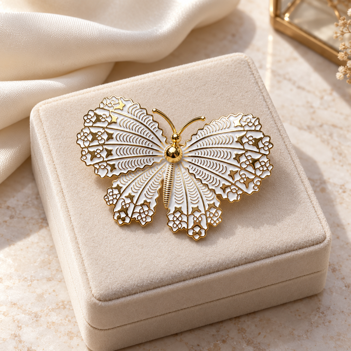 Gold tone and white butterfly brooch in a tabletop display