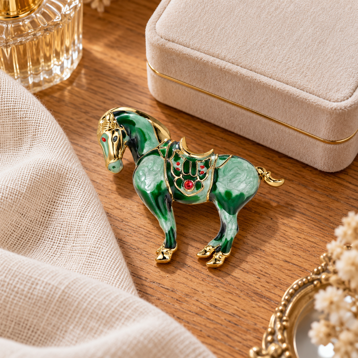 Green horse brooch styled in a tabletop setting