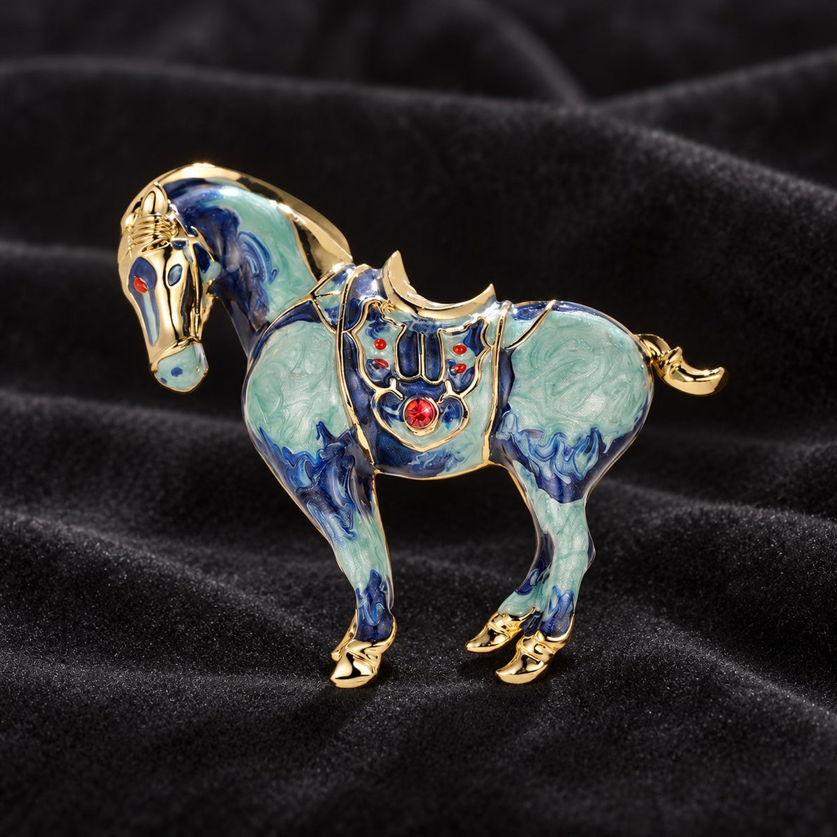 Blue horse brooch with decorative saddle detailing