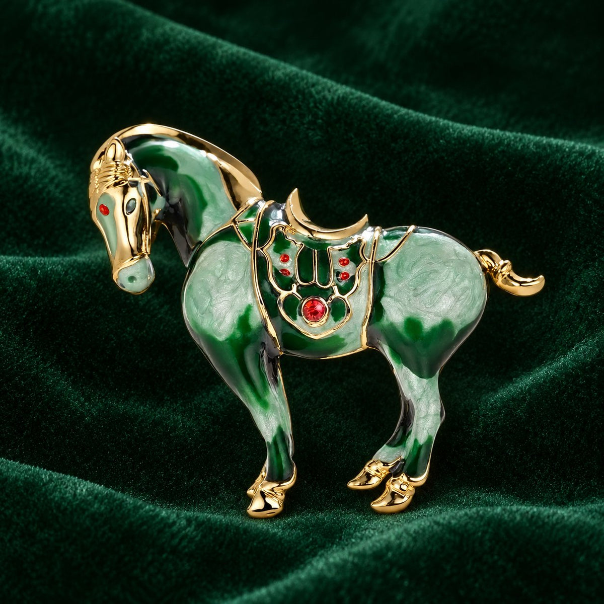 Green horse brooch with decorative saddle detailing