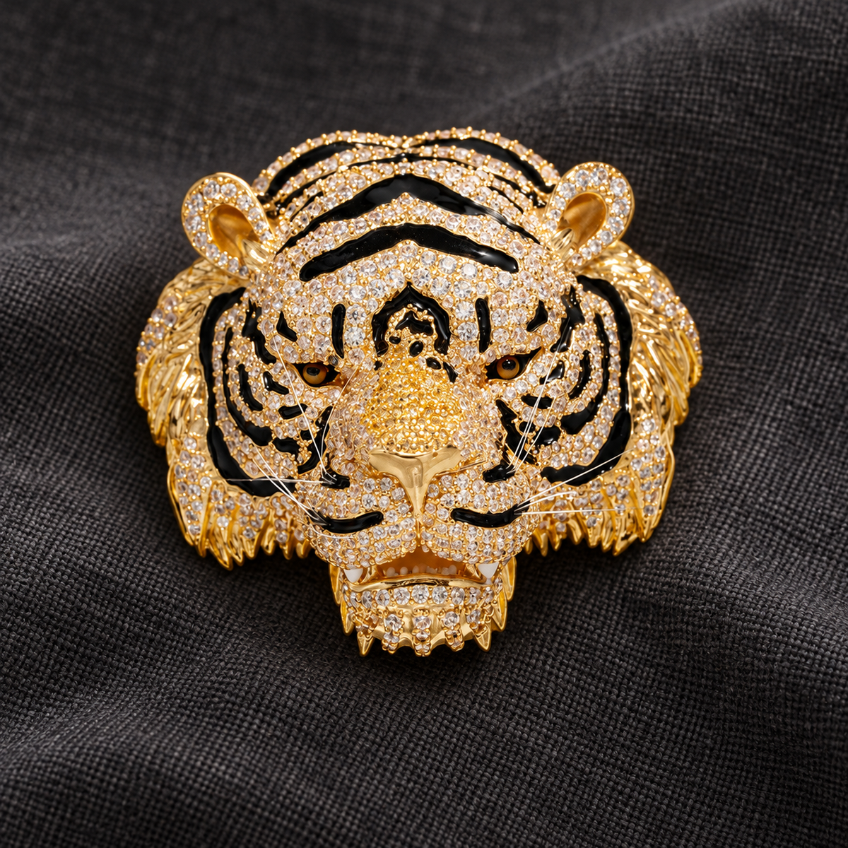 Gold-tone tiger head brooch in a tabletop display
