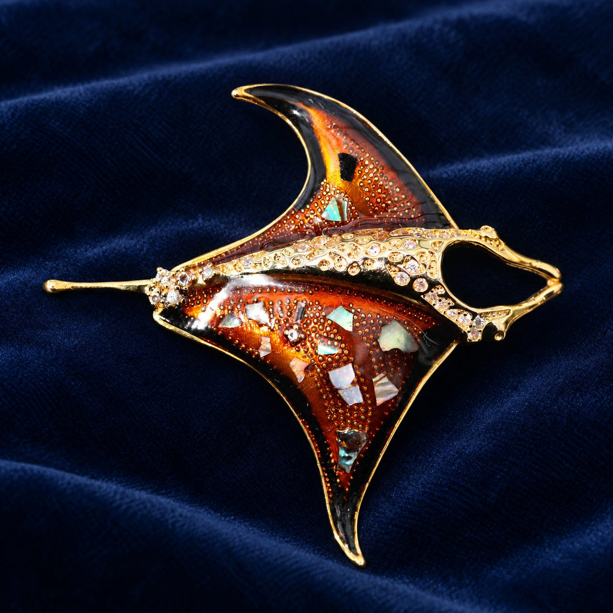 Orange enamel manta ray brooch, front view