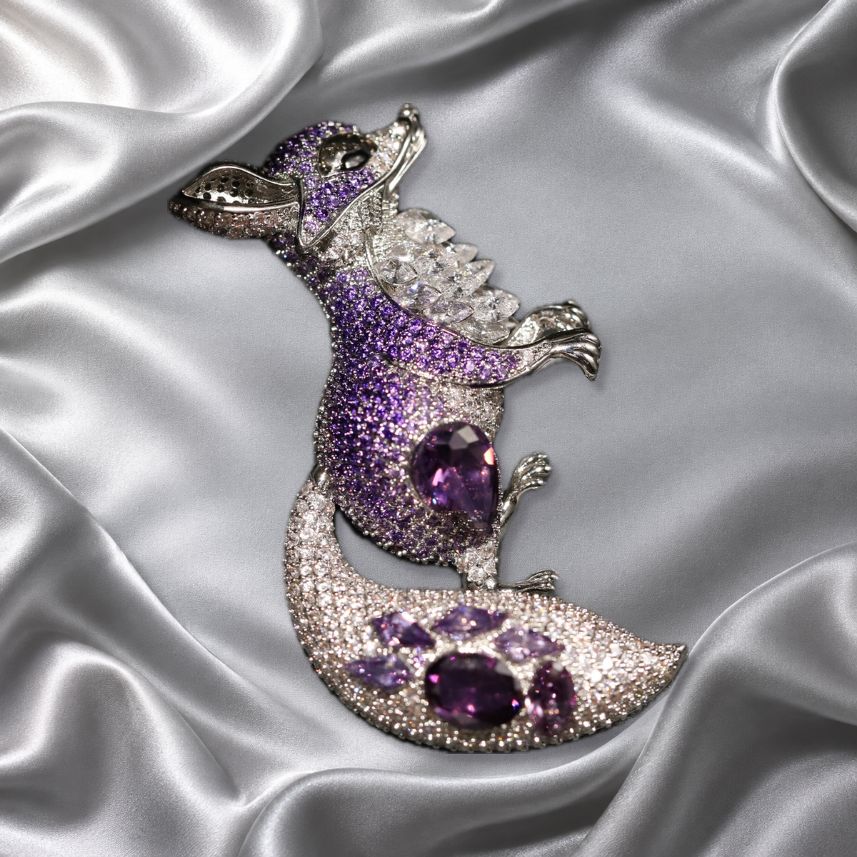 Purple zircon fox brooch on silver satin